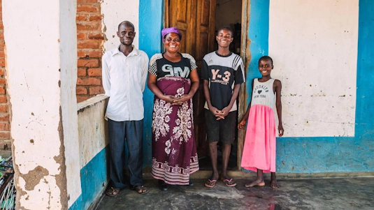 Estele with her husband, Amoz and their two children.